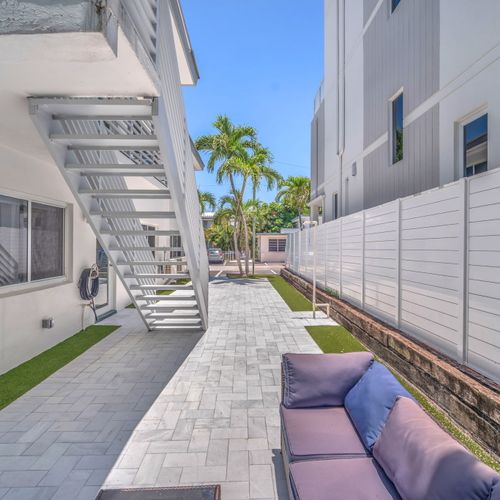 Shared backyard seating area featuring a cozy sectional sofa.