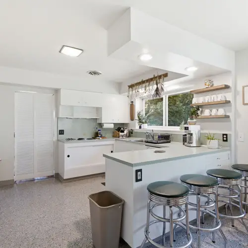 A bright, functional kitchen with bar seating for four.