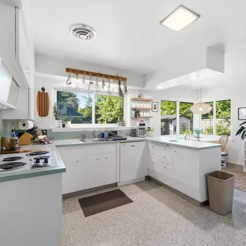 Bright kitchen designed for both convenience and comfort.