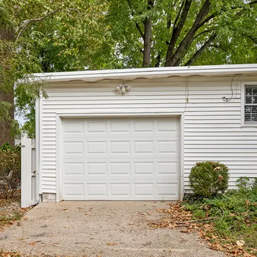Garage not available. BUT, you can park in front of it and certainly fit 1 car! May need to be parked horizontally. But there is a designated space.