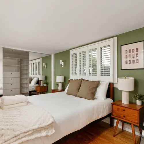 Queen bed, soft light, and zero reason to set an alarm