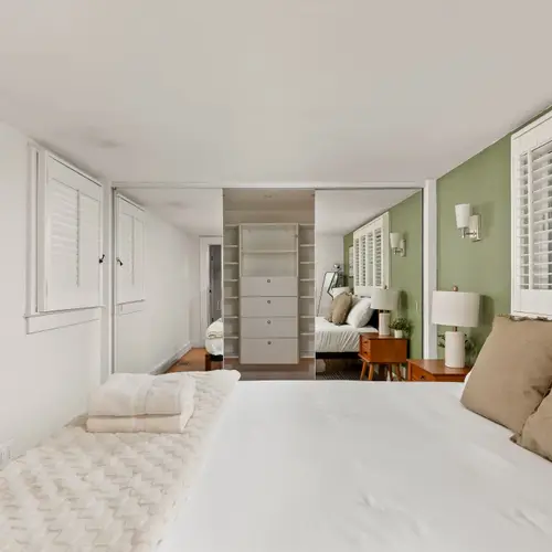 Queen bed, soft light, and zero reason to set an alarm