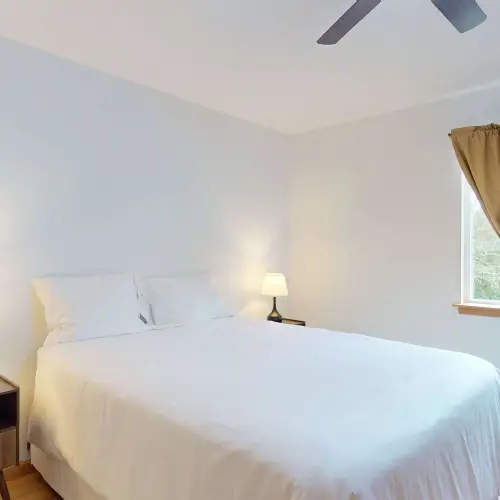 Fresh linens and a comfortable queen bed make winding down easy.