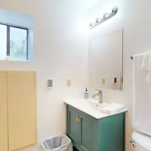 Freshen up after a day at the beach in this clean, comfortable bathroom.
