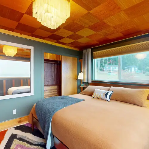 A spacious king bed offers a comfortable place to unwind and recharge.