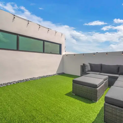 This impressive rooftop deck showcases the pinnacle of luxury outdoor living and modern entertaining.