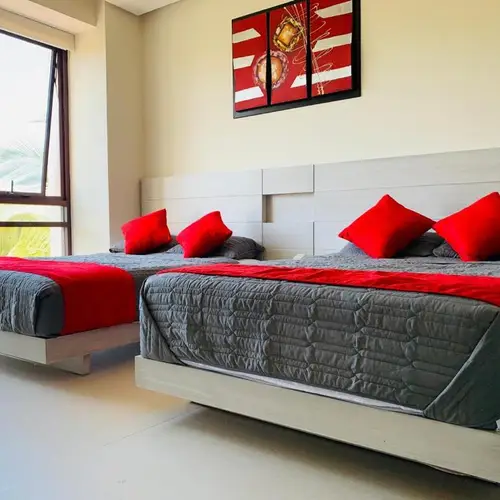 Bedroom 1: two double beds and en-suite bathroom