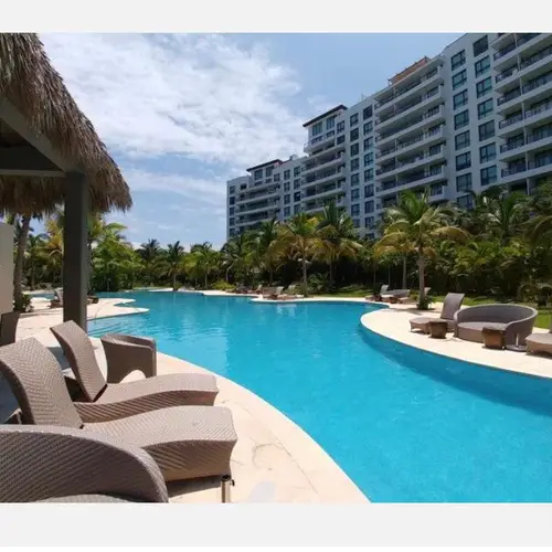 Poolside loungers and palapa for lazy afternoons
