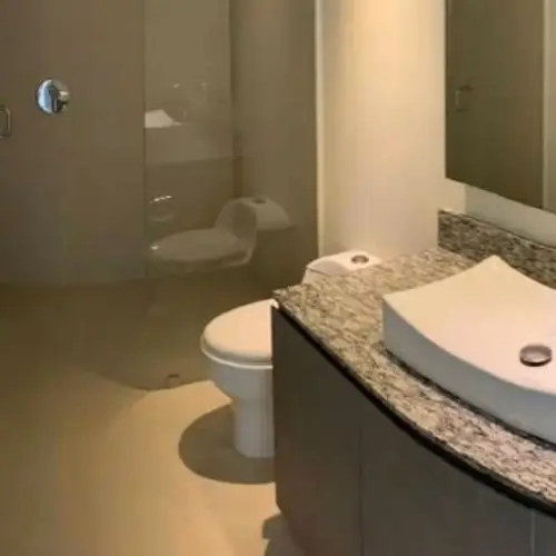 Bathroom with vessel sink and granite vanity