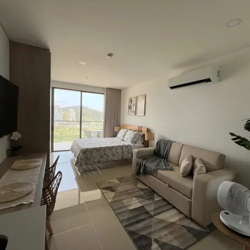 Bright open-plan apartment with mountain views and A/C