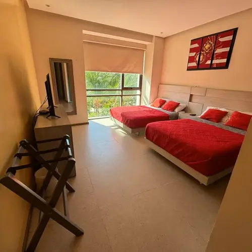 Bedroom 1: two double beds and natural light