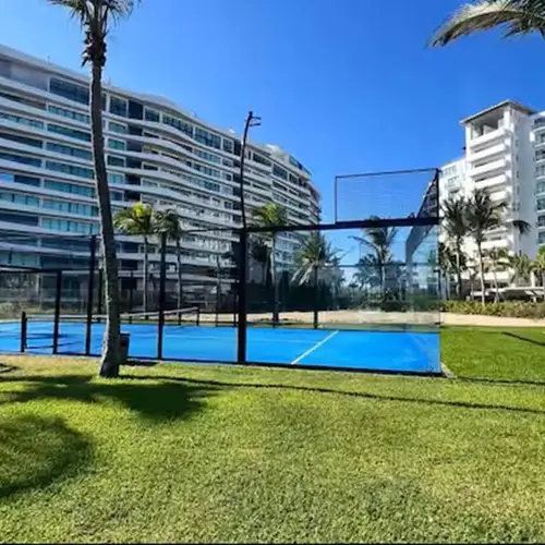 Pool and green lawns framed by the residential towers
