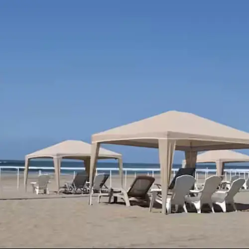 Private beach with shaded cabanas