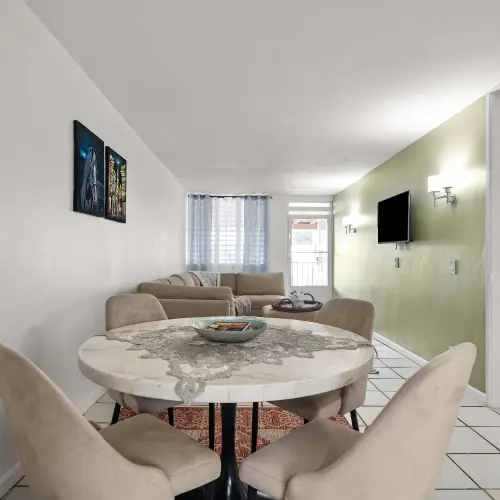 Dining area with round table and upholstered chairs