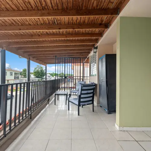 Covered terrace along the front of the house