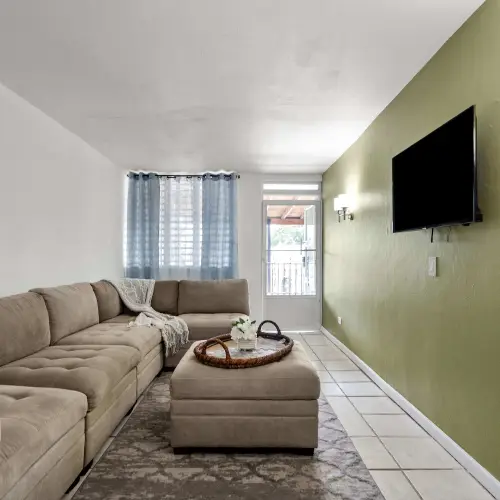 Living room with sectional sofa and ottoman