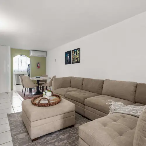 Living room with sectional sofa and wall-mounted TV