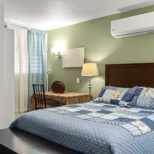 Bedroom 1 with queen bed, desk and A/C