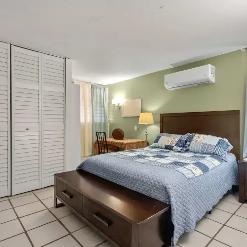 Bedroom 1 with queen bed, closet and A/C