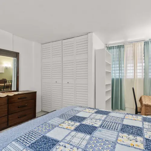 Bedroom 1 with dresser, mirror and closet