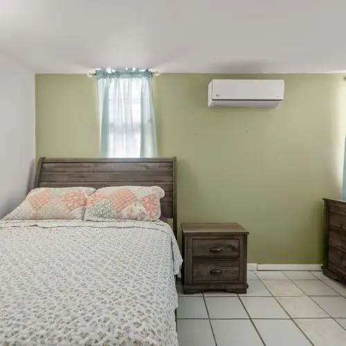 Bedroom 2 with queen bed and dresser