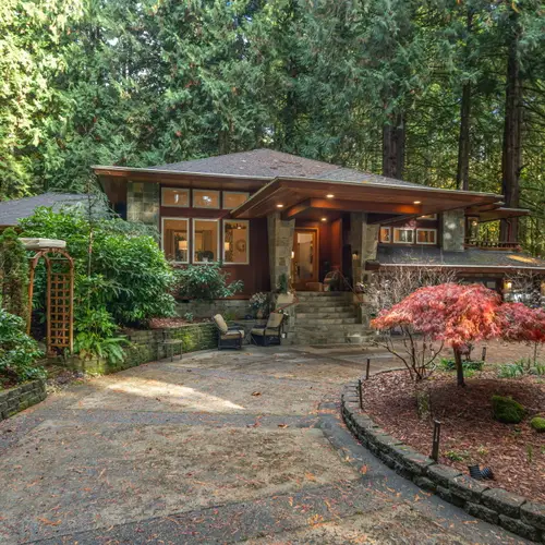 A welcoming entrance surrounded by lush greenery sets the tone for a relaxing stay.