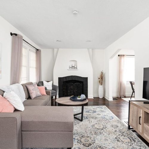 Living Room: Bright and airy space with stylish decor and a warm ambiance for gathering and relaxation.