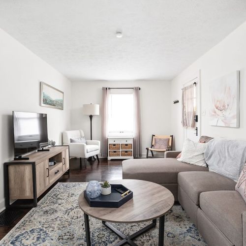 Living Room: Stylish comfort awaits in a sunlit space with plush seating and chic decor!