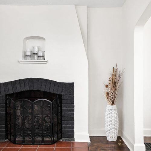 Living Room: Stylish decor and a charming fireplace create the perfect gathering spot for fun!