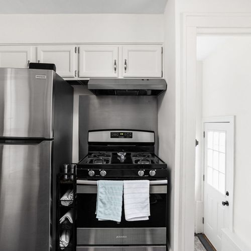 Kitchen: Sleek appliances and bright decor await your culinary adventures in this stylish kitchen!