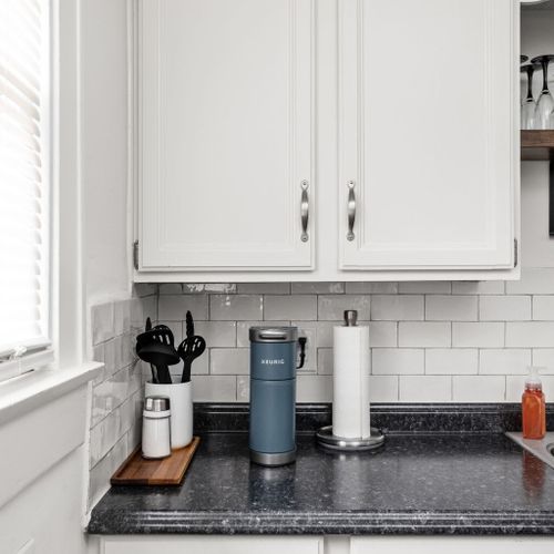 Kitchen: Modern amenities like our Keurig and sleek design make this kitchen a chef's paradise!