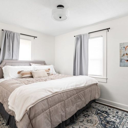 Bedroom: Modern elegance meets inviting comfort with plush bedding and stylish decor!