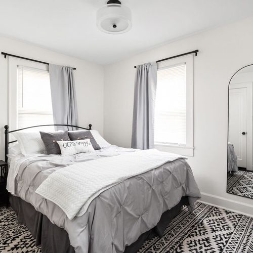 Bedroom: Experience tranquility in this stylish retreat with vibrant decor and natural light!