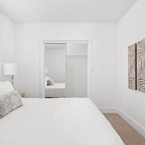 Bedroom: Bright and airy bedroom featuring elegant decor and a serene atmosphere!