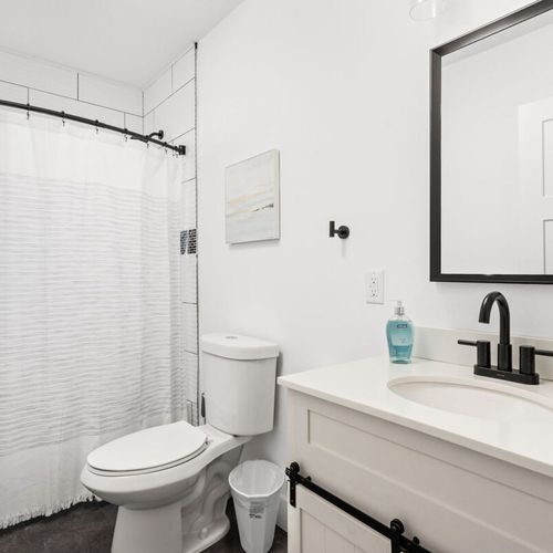 Bathroom: Modern amenities meet a sleek design for your refreshing retreat in Indy!
