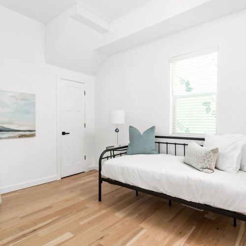 Daybed Retreat: Bright and airy space with chic decor and plush bedding for a peaceful night's sleep!