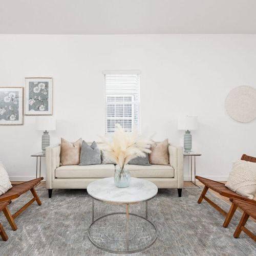Living Room: Stylish space with modern art and inviting seating for fun gatherings or quiet nights in!