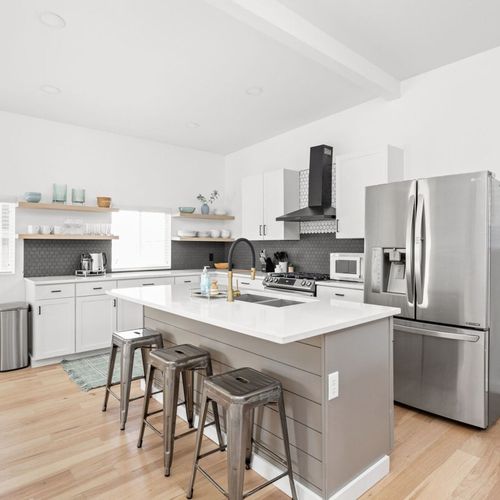 Kitchen: Modern design meets functionality—whip up meals with high-end appliances and natural light!