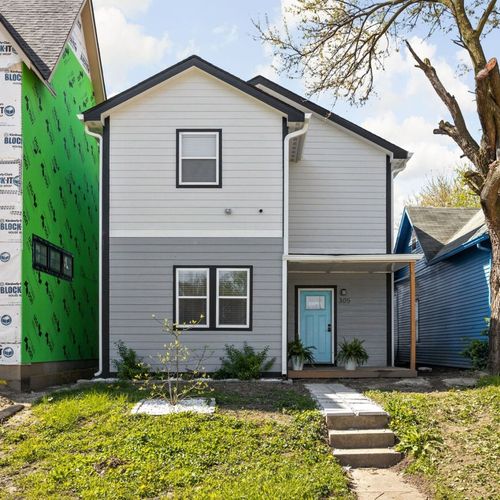 Exterior: Bright and welcoming, with vibrant colors and charming porch—perfect for your getaway!
