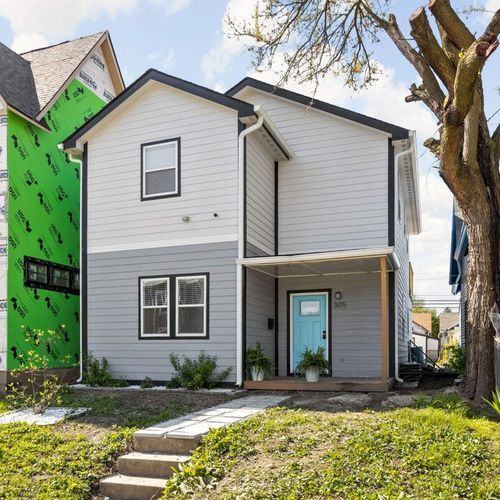 Exterior: Bright and welcoming, with vibrant colors and charming porch—perfect for your getaway!