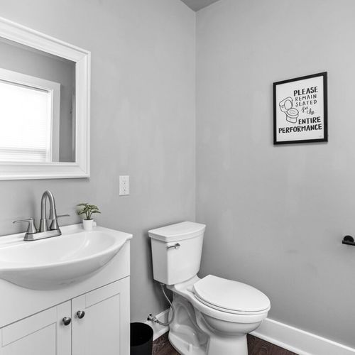 Downstairs half bathroom off of the kitchen.