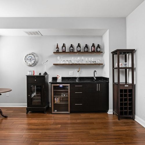 Our sink, cabinets, dresser, and unique collection of wine glasses combine functionality with charm, creating a delightful ambiance in the space.