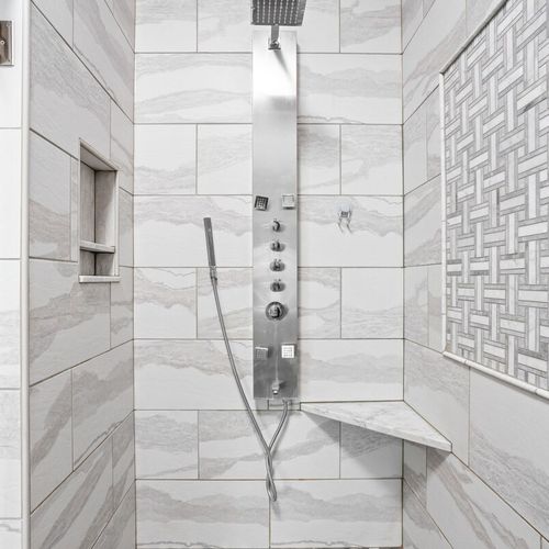 Immerse yourself in our elegant shower space, where luxury seamlessly intertwines with functionality, ensuring a truly rejuvenating bathing experience.