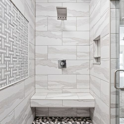 Immerse yourself in our elegant shower space, where luxury seamlessly intertwines with functionality, ensuring a truly rejuvenating bathing experience.