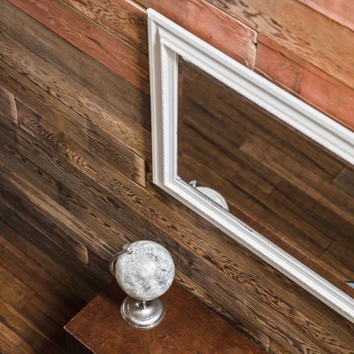 Take in the worldly charm of our decorative globe resting on a table, perfectly complemented by a mirror adorning the wall. Together, they add an air of elegance and intrigue to the space.