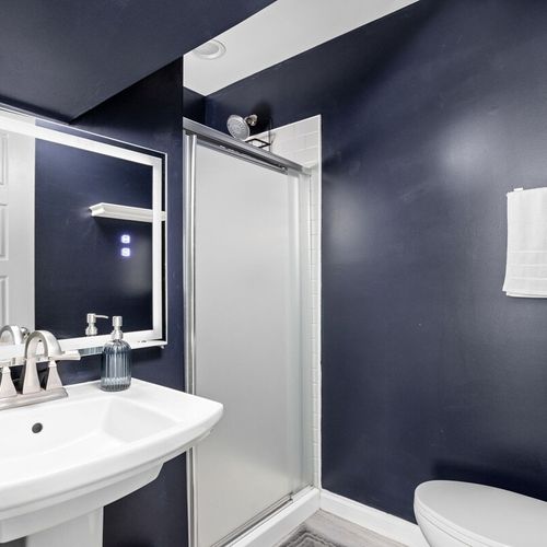 Step into our gleaming bathroom, where every detail shines, complete with all the bathroom essentials you need for a refreshing experience.