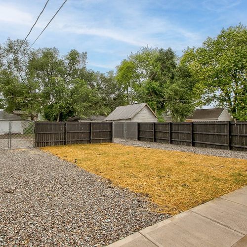 Backyard with fenced in parking. Enough to fit 1-2 cars