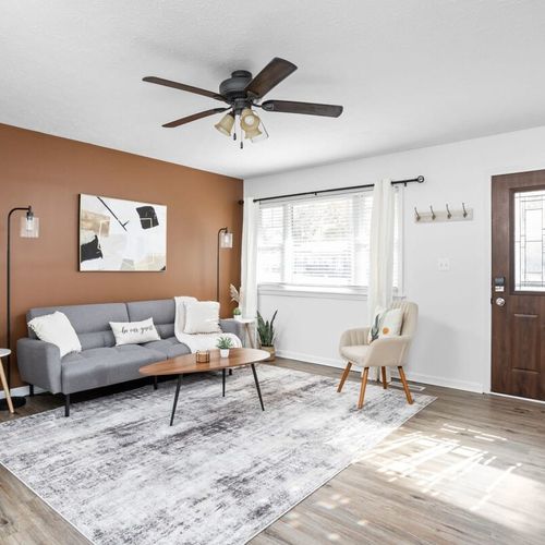 Living Room: Bright and airy space perfect for relaxing with friends or catching up on shows!