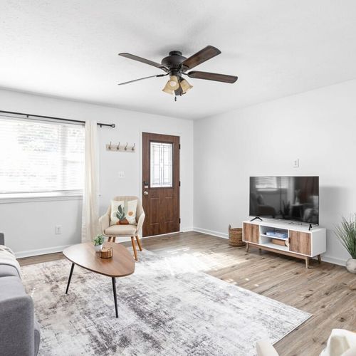 Living Room: Bright and airy space perfect for relaxing with friends or catching up on shows!