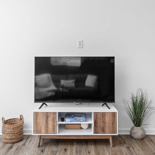 Living Room: Bright and airy space perfect for relaxing with friends or catching up on shows!